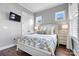 Bedroom featuring hardwood floors, bright natural light from multiple windows and ensuite bathroom at 4998 Looking Glass Trl, Denver, NC 28037