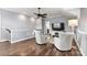 Upstairs bonus room featuring hardwood floors, high ceilings, and a cozy seating area at 4998 Looking Glass Trl, Denver, NC 28037