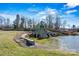 Community entrance with pond and stone waterfall at 4998 Looking Glass Trl, Denver, NC 28037