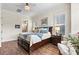 Spacious main bedroom with hardwood floors, a ceiling fan, and an ensuite bathroom at 4998 Looking Glass Trl, Denver, NC 28037