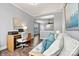 Cozy home office with a desk setup next to a comfortable seating area in a well-lit room at 4998 Looking Glass Trl, Denver, NC 28037