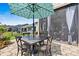 Outdoor patio with table, chairs, and umbrella at 4998 Looking Glass Trl, Denver, NC 28037