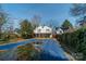 The backyard features a covered pool, wooden fence, and the back of the house with a deck at 531 Elm St, Salisbury, NC 28144