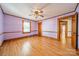 Bedroom featuring hardwood floors, a ceiling fan, and classic trim with ample light at 531 Elm St, Salisbury, NC 28144