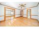 Well-lit bedroom featuring hardwood floors and mirrored closet doors at 531 Elm St, Salisbury, NC 28144