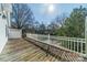 This wooden deck offers a great outdoor space, featuring white railings and a view of the backyard at 531 Elm St, Salisbury, NC 28144