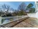 Wooden deck with white railing overlooking the backyard at 531 Elm St, Salisbury, NC 28144