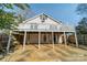 Rear exterior of the home with a deck, supports, and access to the backyard at 531 Elm St, Salisbury, NC 28144