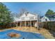Exterior showing a home with a deck, spiral staircase and covered patio area for outdoor enjoyment at 531 Elm St, Salisbury, NC 28144
