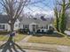 Charming home with a well-manicured lawn, complemented by lovely landscaping, and inviting curb appeal at 531 Elm St, Salisbury, NC 28144