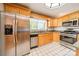 Bright kitchen with stainless steel appliances, granite countertops, wooden cabinets and a window at 531 Elm St, Salisbury, NC 28144