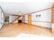 Open-concept living room with hardwood floors, fireplace, and easy access to the kitchen and staircase at 531 Elm St, Salisbury, NC 28144