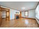 Spacious living room featuring gleaming hardwood floors, a cozy fireplace, and abundant natural light at 531 Elm St, Salisbury, NC 28144