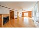Spacious living room featuring hardwood floors, fireplace, and built-in shelving with access to the exterior at 531 Elm St, Salisbury, NC 28144