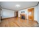 Bright living room featuring hardwood floors, a classic fireplace, and ample space for relaxation at 531 Elm St, Salisbury, NC 28144