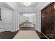 Elegant entryway with dark hardwood floors and double doors at 5527 Carmel Park Dr, Charlotte, NC 28226