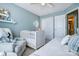 Light and airy Bedroom with crib, closet, and easy access to the Primary bath at 5806 Glassport Ln, Charlotte, NC 28210