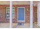 Townhouse with a teal front door and brick facade at 5979 Cougar Ln, Charlotte, NC 28269