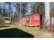 Red shed with swing in a wooded backyard at 630 Montgomery Dr, Rock Hill, SC 29732