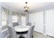 Bright breakfast nook features a round table and four chairs, offering a cozy dining space at 630 Montgomery Dr, Rock Hill, SC 29732
