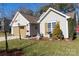 Tan house with attached garage and landscaped yard at 630 Montgomery Dr, Rock Hill, SC 29732