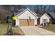 House exterior featuring a two-car garage and landscaped yard at 630 Montgomery Dr, Rock Hill, SC 29732