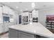 Modern kitchen with white cabinets, stainless steel appliances, and large island at 7853 Ballentrae Pl, Stanley, NC 28164