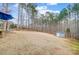 Expansive backyard features a storage shed, level ground, and wooded backdrop at 109 Belfry Loop, Mooresville, NC 28117