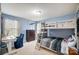 Bedroom with bunkbeds, desk, and blue walls offers a cozy space for children at 109 Belfry Loop, Mooresville, NC 28117