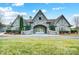 Attractive community clubhouse entrance with stone and manicured landscaping at 109 Belfry Loop, Mooresville, NC 28117