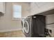 Laundry room with modern appliances, and a bright window for natural lighting at 109 Belfry Loop, Mooresville, NC 28117