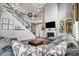 Large living room with fireplace, built in shelving, hardwood floors and natural light at 109 Belfry Loop, Mooresville, NC 28117