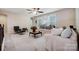 Bright and airy living room featuring modern furniture, large windows, and a ceiling fan at 109 Belfry Loop, Mooresville, NC 28117