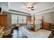 Comfortable main bedroom with a ceiling fan, natural light, and classic furnishings at 109 Belfry Loop, Mooresville, NC 28117