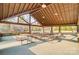 Community pavilion with picnic tables and view of playground beyond at 109 Belfry Loop, Mooresville, NC 28117