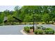 Park and playground area featuring a covered picnic area surrounded by mature trees and landscaping at 109 Belfry Loop, Mooresville, NC 28117