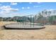 Community playground with swings and playground and covered pavilion in background at 109 Belfry Loop, Mooresville, NC 28117