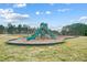 Outdoor community playground with a slide, swings, and protective mulch at 109 Belfry Loop, Mooresville, NC 28117