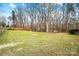 Large backyard with grassy area and wooded backdrop at 109 Rob Ln, Mooresville, NC 28117