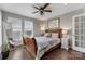 Cozy bedroom with wood sleigh bed and window seating at 109 Rob Ln, Mooresville, NC 28117