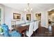 Bright dining room featuring a wood table and chandelier at 109 Rob Ln, Mooresville, NC 28117