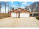 Two-car garage with basketball hoop and ample driveway space at 109 Rob Ln, Mooresville, NC 28117