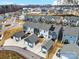 A drone's eye view of a neighborhood with individual detached garages for each townhome unit at 1108 Township Pkwy, Belmont, NC 28012