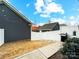 Fenced-in backyard with lawn and grill at 1108 Township Pkwy, Belmont, NC 28012