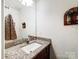 Powder room with granite countertop and decorative wall accents at 1108 Township Pkwy, Belmont, NC 28012