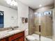 Bathroom with granite vanity, modern fixtures, and tiled walk-in shower at 1108 Township Pkwy, Belmont, NC 28012