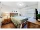 Cozy bedroom featuring wood furnishings and a bright window at 1108 Township Pkwy, Belmont, NC 28012