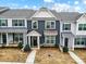 Charming townhome features a stylish facade, manicured lawn, and inviting entryway at 1108 Township Pkwy, Belmont, NC 28012