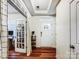 Inviting foyer with hardwood floors, leading to a sunlit office space at 1108 Township Pkwy, Belmont, NC 28012