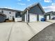 Two-car garage with an extra storage room on an ample driveway at 1108 Township Pkwy, Belmont, NC 28012